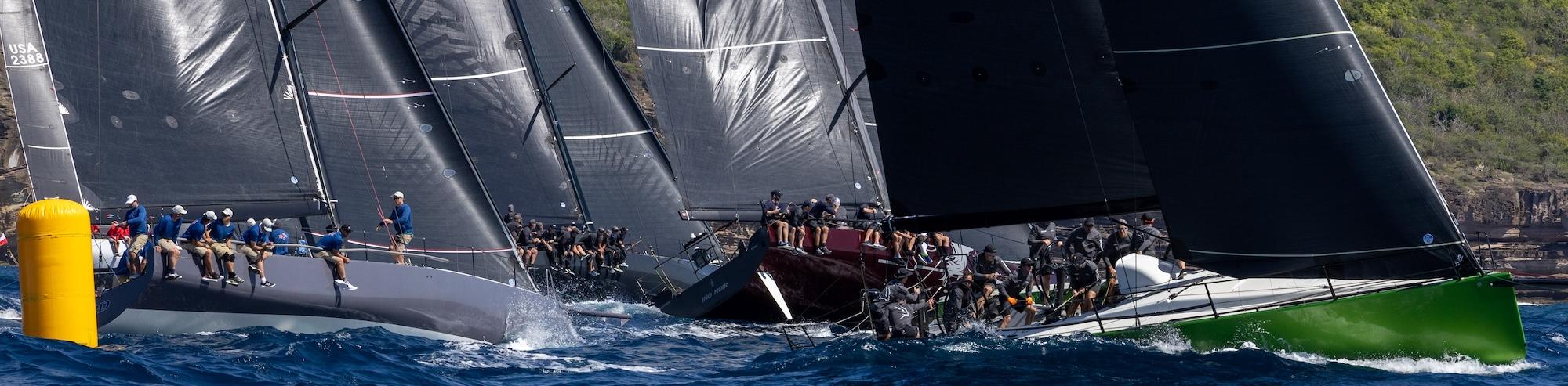 The RORC Nelson’s Cup Series kicked off today with two superb races starting off Fort Charlotte, Antigua. Race results were decided by very close margins. Two teams remain unbeaten in the RORC Nelson’s Cup Series: Wendy Schmidt’s Botin 85 Deep Blue (USA) and Frederic Puzin’s Ker 46 Daguet 3 (FRA). RP37 Warthog (ANT), skippered by Jules Mitchell with an all-Antiguan crew, leads IRC Two on countback from Ed Bell’s Dawn Treader.
